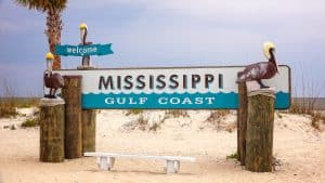 Welkomstbord Mississippi Gulf Coast op het strand